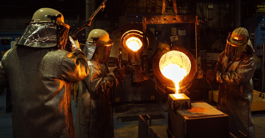Workers at Wall Colmonoy’s Pontardawe facility pouring molten metal during the alloy casting process.