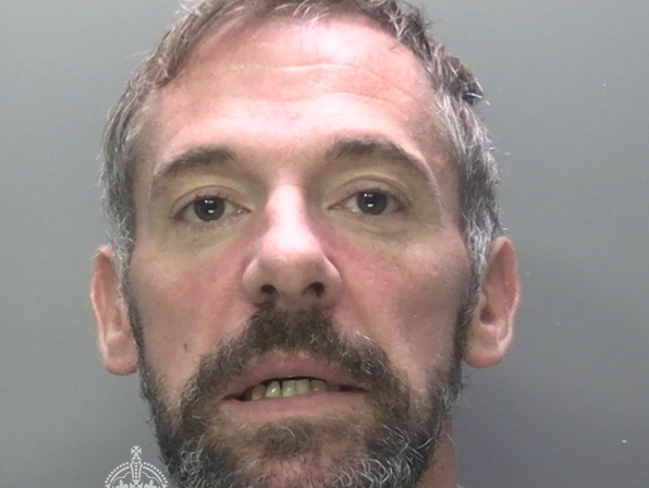 Police custody image of Christopher Sayce, 42, who admitted arson after a fire at supported accommodation in Swansea.