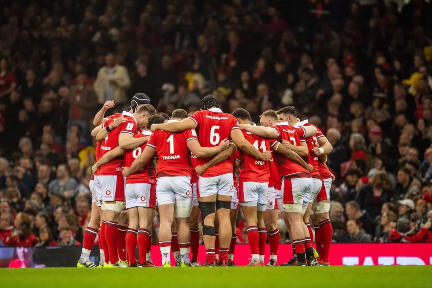 WRPA players huddle on the pitch before a URC match, united ahead of talks over Welsh rugby’s future.