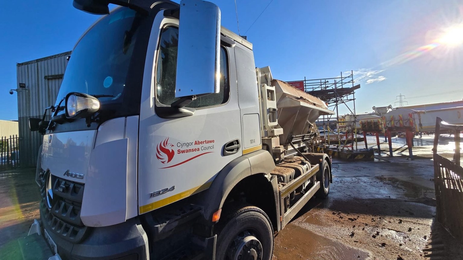 Swansea Council gritting lorry spreading salt on a road during winter conditions.