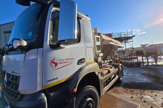 Swansea Council gritting lorry spreading salt on a road during winter conditions.