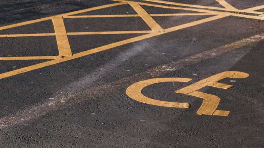 Disabled parking bay with clear road markings.