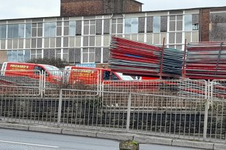 Prichard’s contractors and equipment on the fenced demolition site at the former Daniel James Community School.
