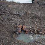 Water flowing from a damaged underground brick structure at the Cwmfelin site.