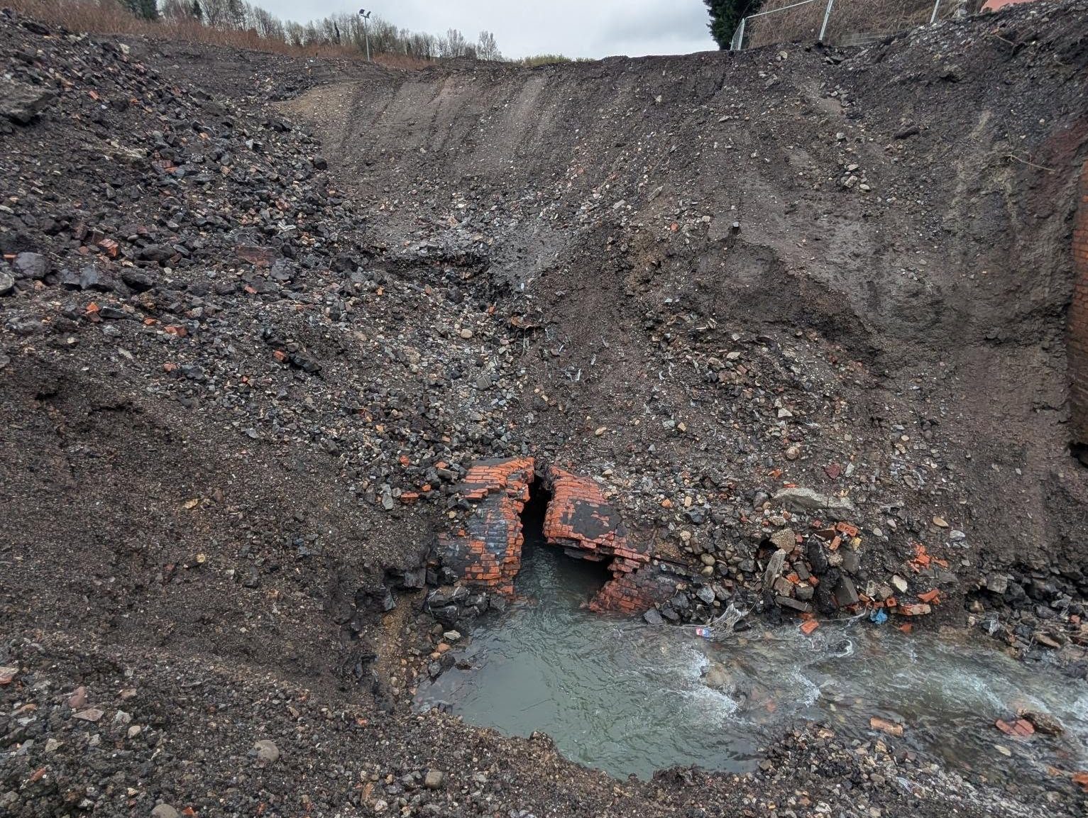 Water flowing from a damaged underground brick structure at the Cwmfelin site.
