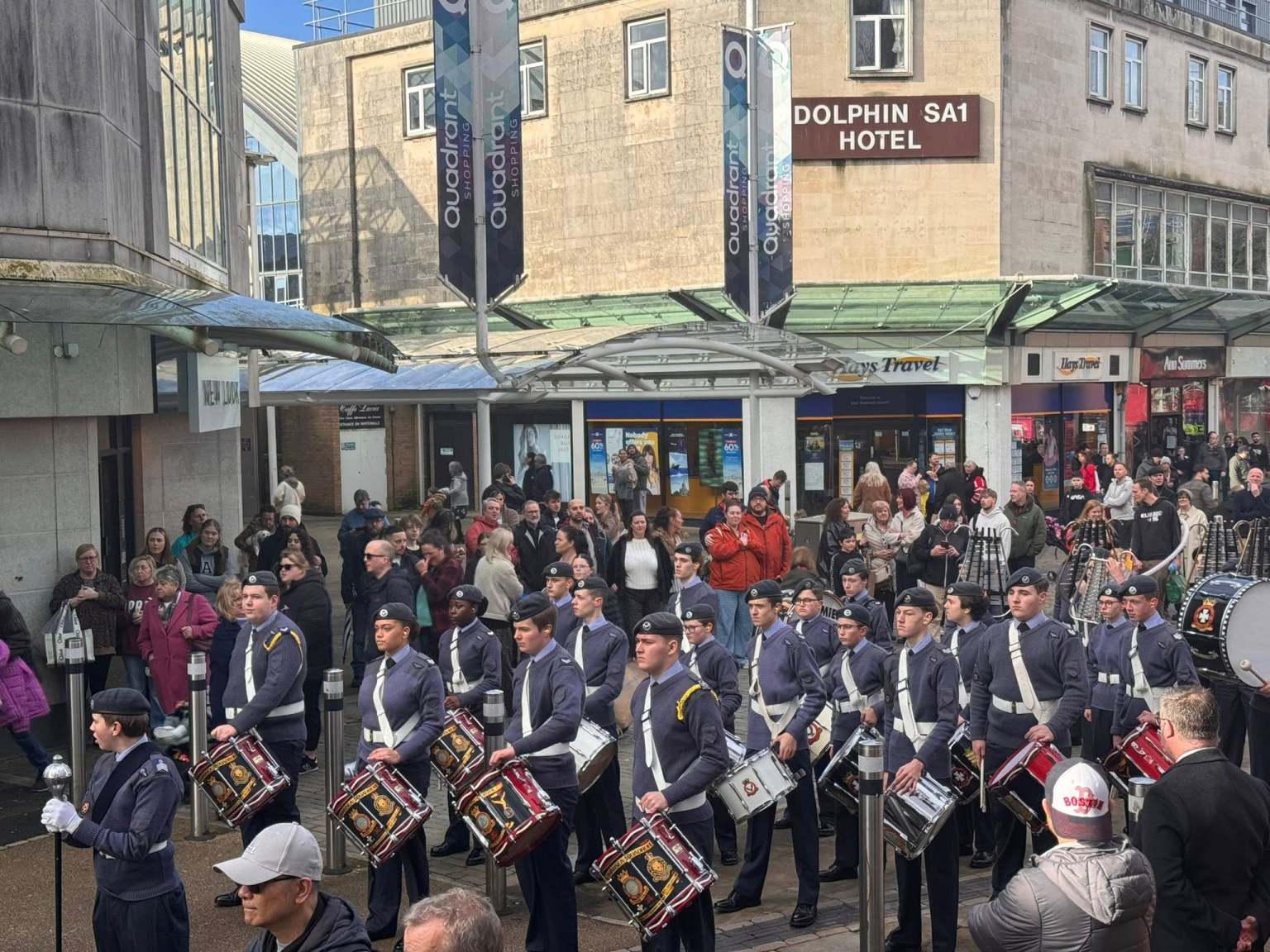 RAF Air Cadets marching band performing on Oxford Street in Swansea as crowds watch from the pavement.