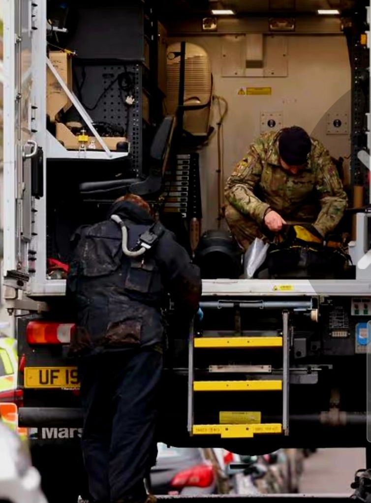 Bomb disposal officers working from a specialist vehicle during ongoing searches in Abergwynfi.