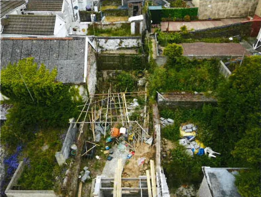 Aerial view of an unsafe, partially built construction site associated with rogue builder Lee Slocombe’s fraudulent work.