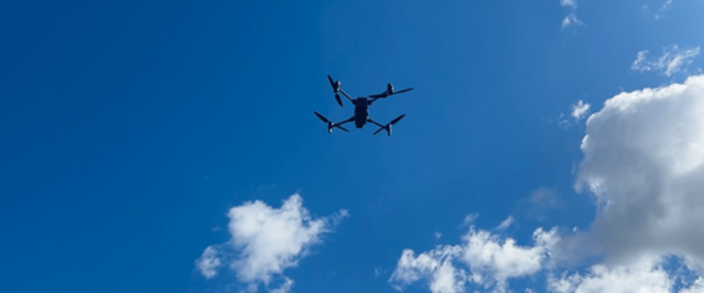 new Ambulance Service drone flying in a clear blue sky.