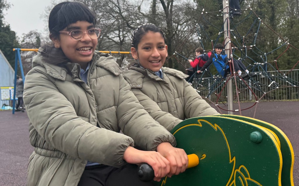 Children playing on new equipment at Coed Gwilym Park Clydach Swansea Council play area investment