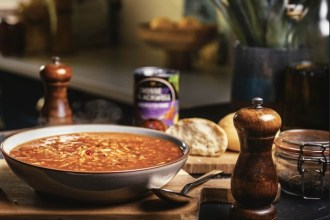 A steaming bowl of minestrone soup