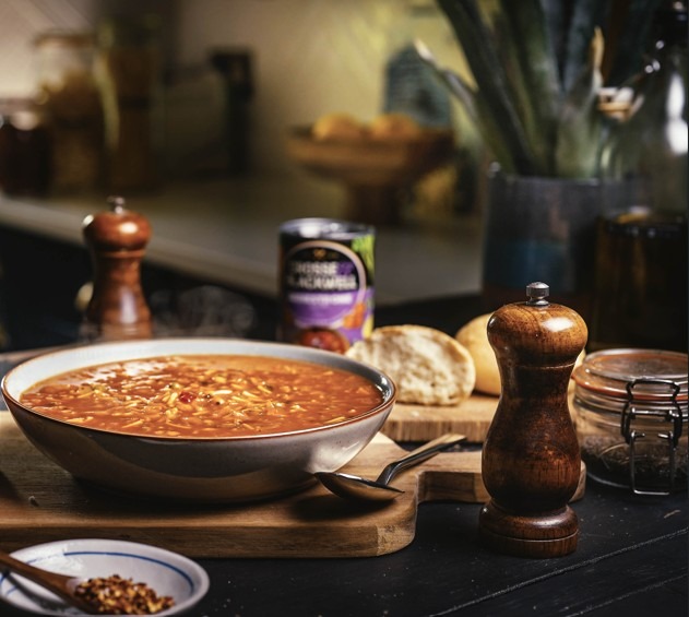 A steaming bowl of minestrone soup