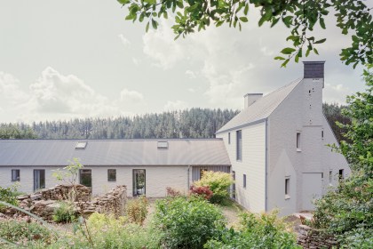 Pantybara’s main house set against woodland, showing modern rural architecture.