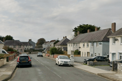 Residential street view of Hawkstone Road in Pembroke Dock with parked cars and semi‑detached houses.