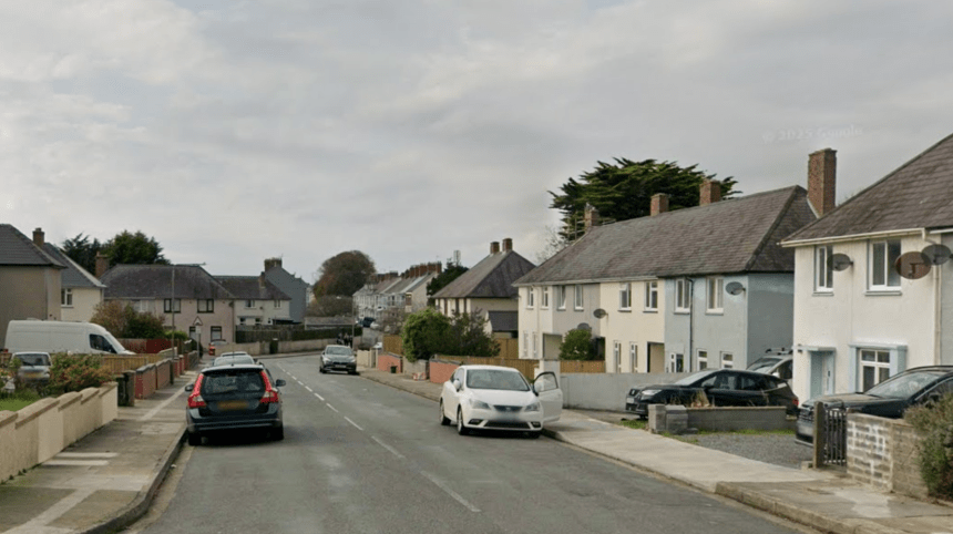 Residential street view of Hawkstone Road in Pembroke Dock with parked cars and semi‑detached houses.