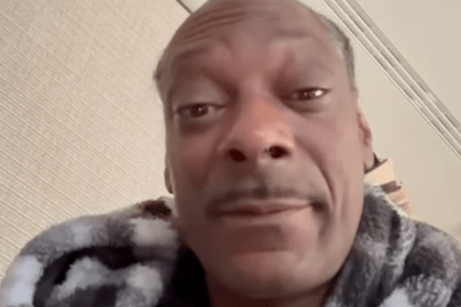 Snoop Dogg wrapped in a patterned blanket indoors ahead of attending his first Swansea City match as a club investor on 24 February.