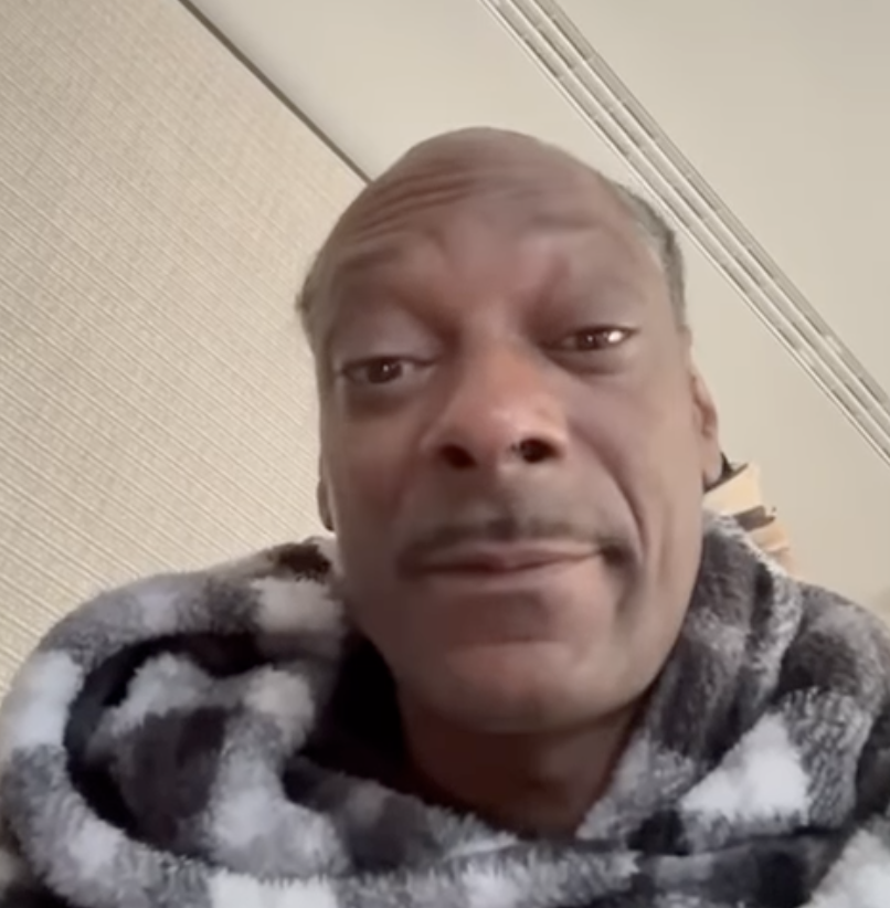 Snoop Dogg wrapped in a patterned blanket indoors ahead of attending his first Swansea City match as a club investor on 24 February.