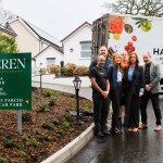 Outdoor group photo outside Y Seren Hotel showing head chef Navi Mudaly, Harlech Foodservice staff and hotel owners Andrea and Tudur Williams beside a branded delivery vehicle.