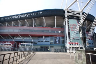 Exterior view of the Principality Stadium in Cardiff, showing the stadium structure and surrounding area.