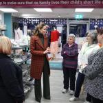 The Princess of Wales speaking with staff and volunteers inside the Tŷ Hafan charity shop in Lampeter.
