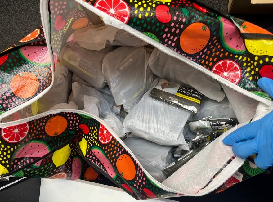 Bag containing illegal vapes and counterfeit tobacco seized by Swansea Trading Standards during an enforcement operation.