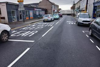 Newly resurfaced road in Gorseinon with clear road markings after council repair works.