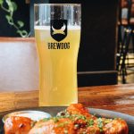 glass of brewdog beer with chicken legs
