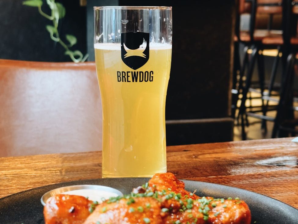 glass of brewdog beer with chicken legs