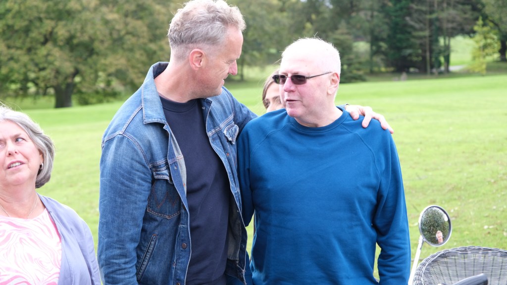 Nominator Gill Mason with Tim Shaw and nominee Ian Davies during the reveal of the Triumph Bonneville. (National Geographic/Steve Bonser)