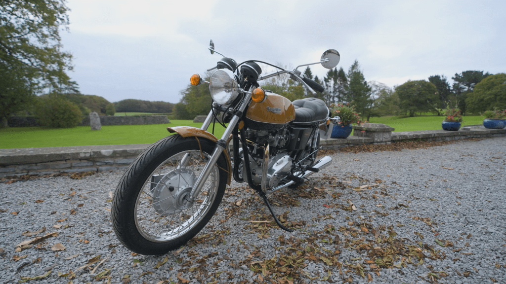The fully restored 1973 Triumph Bonneville is revealed in pristine condition.