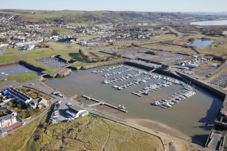 Aerial view of Burry Port Harbour marina and surrounding coastline in Carmarthenshire
