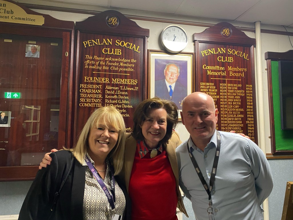 Eluned Morgan with Alison Martin, Club Secretary and regulars at Penlan Social Club.