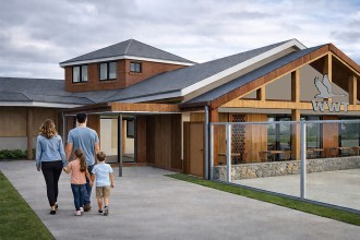 Artist’s impression showing a family walking towards a redesigned timber-clad entrance building at WWT Llanelli Wetland Centre with improved access and modern facilities.