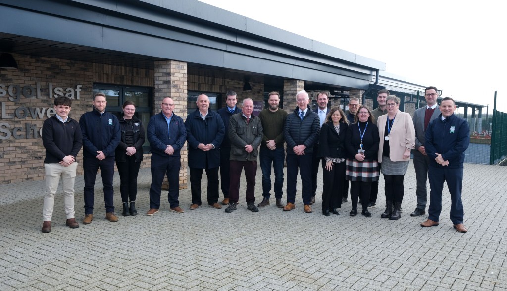 Officials and school leaders posing outside the entrance to Portfield School during a visit to mark the opening of the new facilities.