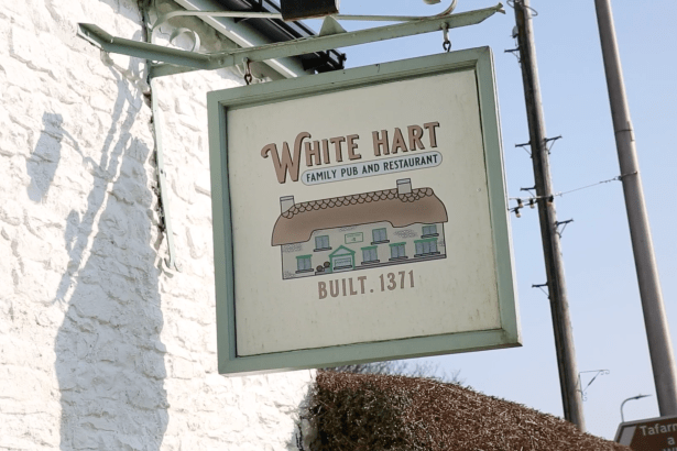 Sign outside the White Hart pub showing “Family Pub and Restaurant” and “Built 1371”