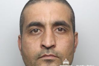Custody image of Talha Ahmadzai released by Dyfed-Powys Police following his sentencing at Swansea Crown Court for multiple serious sexual offences