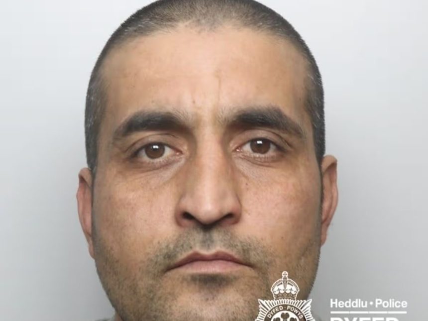 Custody image of Talha Ahmadzai released by Dyfed-Powys Police following his sentencing at Swansea Crown Court for multiple serious sexual offences