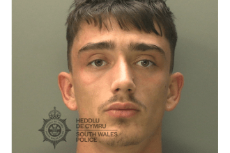 A mugshot of a young man, Connor Wing, with short dark hair and a light grey t-shirt, looking directly at the camera.