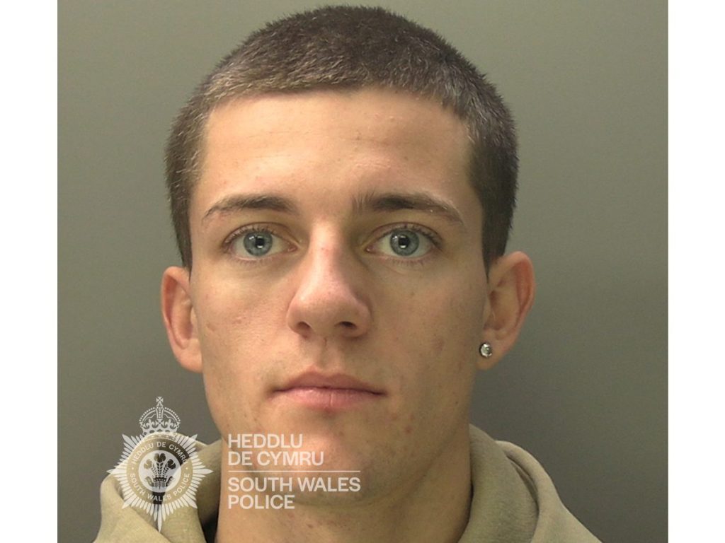 Custody image of Ellis Lloyd, a 19-year-old man from Cefn Cribwr, issued by South Wales Police.