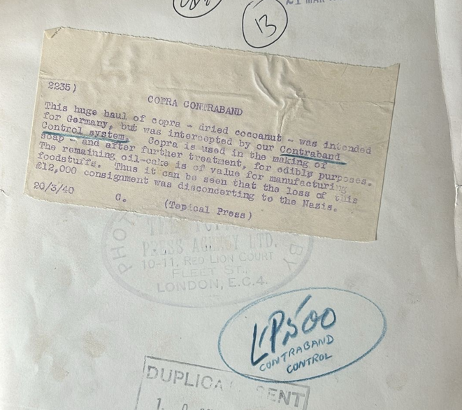 Typed press caption dated March 1940 explaining that the photograph shows copra intended for Germany seized by British Contraband Control during the Second World War.