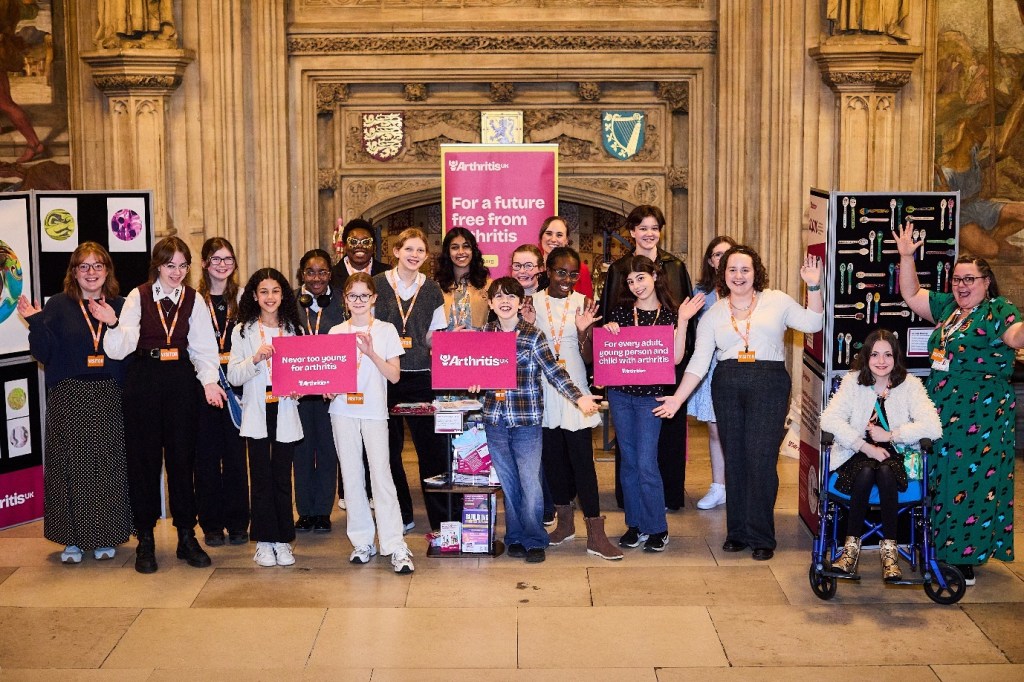 Group of young people and supporters at the Inside Arthritis exhibition in Parliament, part of Arthritis UK’s Joint Creativity programme.