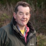A headshot of Patrick Benham-Crosswell