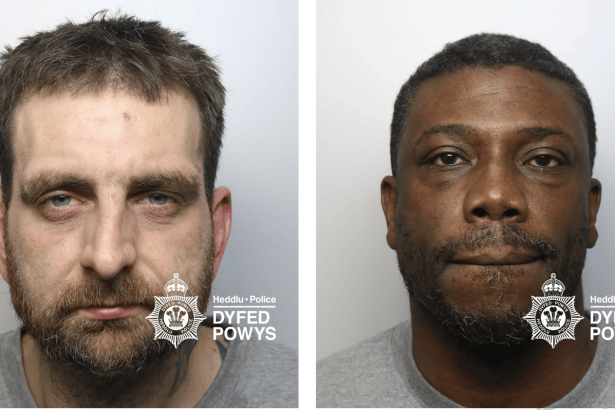 A composite image showing the police mugshots of two men. On the left is Simon Dickey, a white man with a beard and short brown hair. On the right is Mikael Bourkhari, a Black man with short dark hair and a goatee. Both are wearing grey t-shirts and the image features the Dyfed-Powys Police watermark.