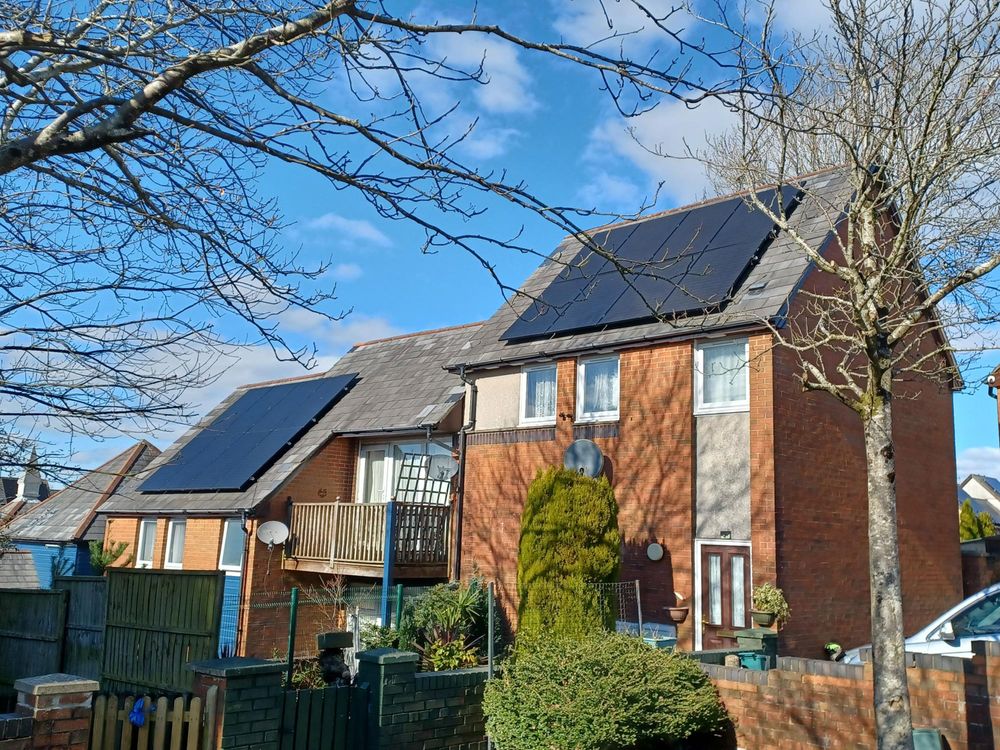 Houses with solar panels installed in Penderi Swansea as part of energy retrofit project to reduce energy bills