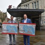 Ken Skates and Rob Stewart unveil plans for the Swansea Bay Metro at Swansea railway station.