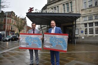 Ken Skates and Rob Stewart unveil plans for the Swansea Bay Metro at Swansea railway station.