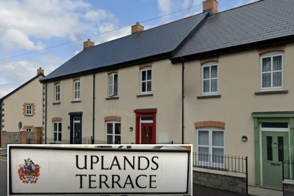 The new Uplands Terrace street nameplate in Morriston, featuring Swansea's coat of arms — the first of a new generation of signs being rolled out across the city. Image: Swansea Council/Google Maps
