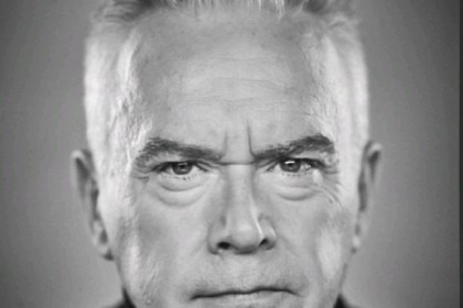 Black and white portrait of Huw Edwards