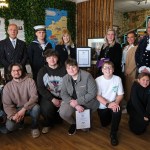 Nicola Harteveld and Megan's Starr Foundation volunteers receive the King's Award for Voluntary Service from Lord Lieutenant of Dyfed Miss Sara Edwards at the Dizzy Bear Café in Milford Haven.