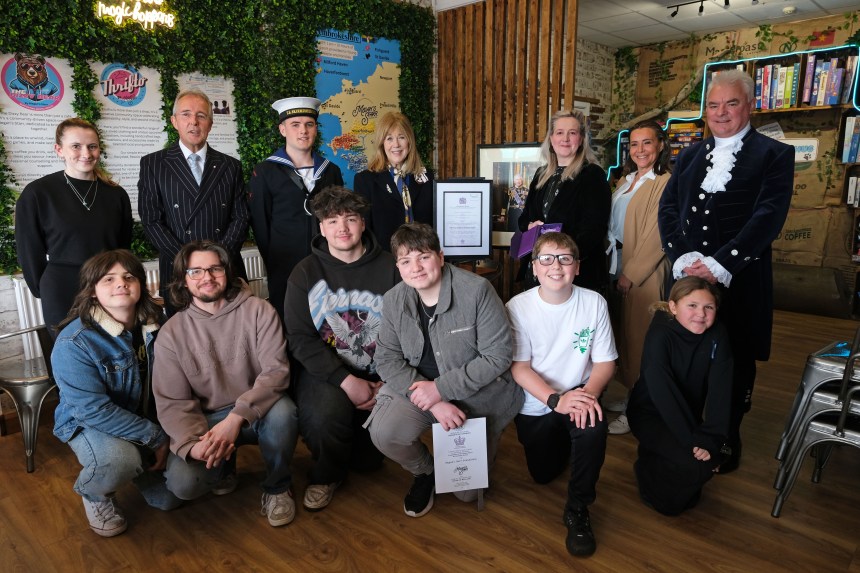 Nicola Harteveld and Megan's Starr Foundation volunteers receive the King's Award for Voluntary Service from Lord Lieutenant of Dyfed Miss Sara Edwards at the Dizzy Bear Café in Milford Haven.